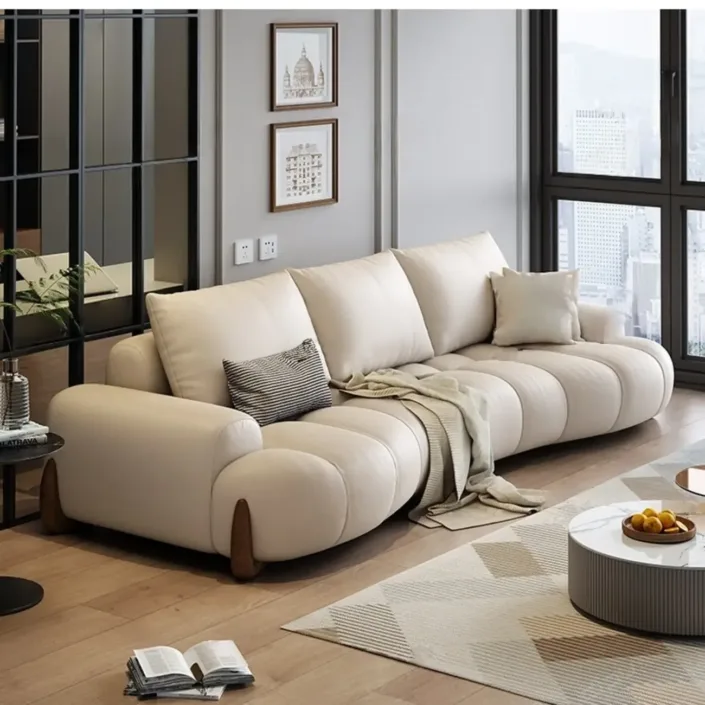Globe Furnishings - Italian Curved Cream-Colored Leather Sofa Globe Furnishings - Italian Curved Cream-Colored Leather Sofa